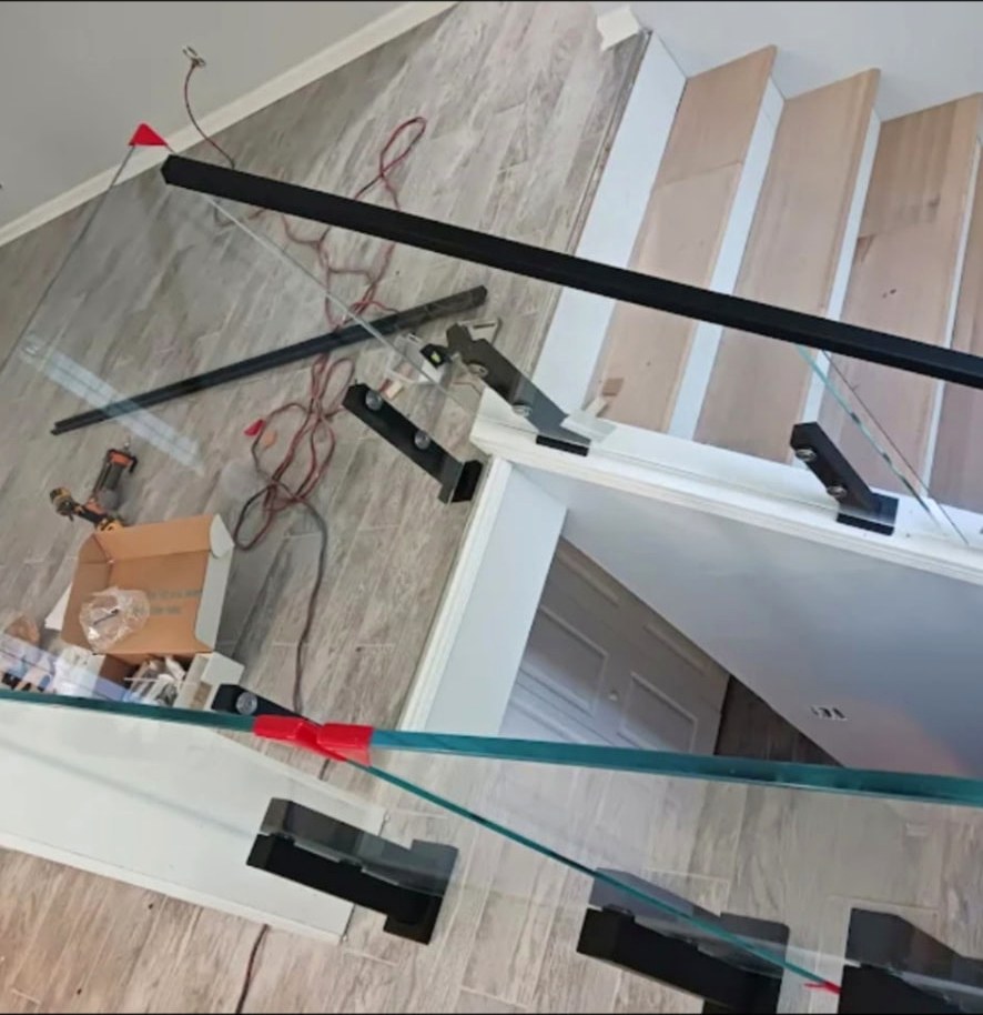 Glass stair railing installation