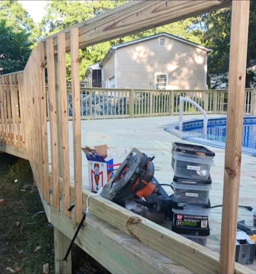 Deck railing framing over pool deck