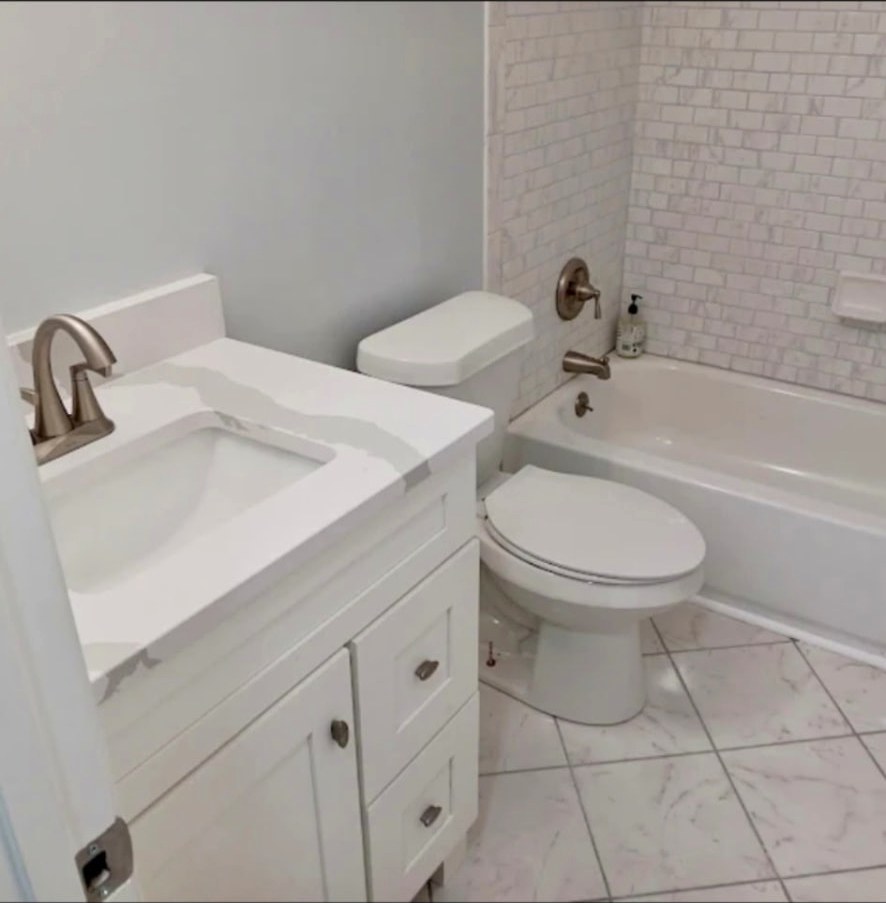Full bathroom remodel with tile surround